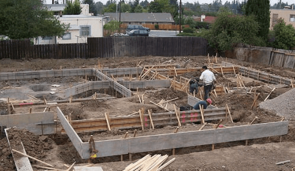 Foundation footings and formwork being prepared for a new concrete slab pour